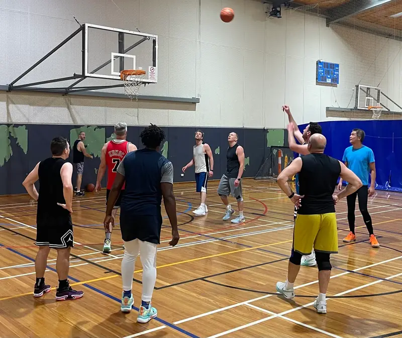 Friday Hoops players contesting a shot during a Friday morning run in Melbourne